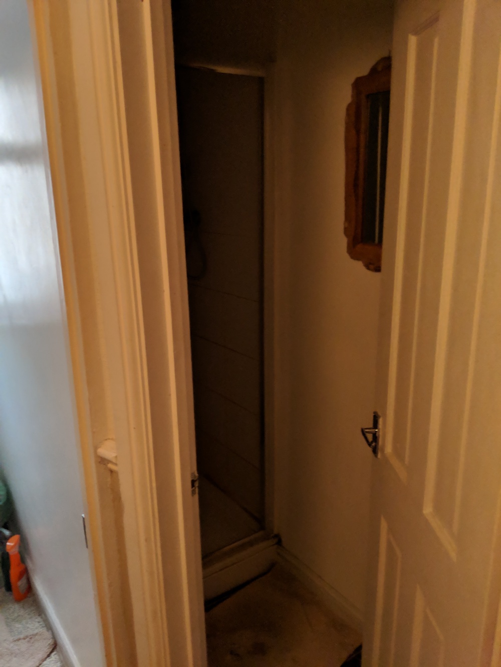 The original gloomy shower room, taken from the doorway